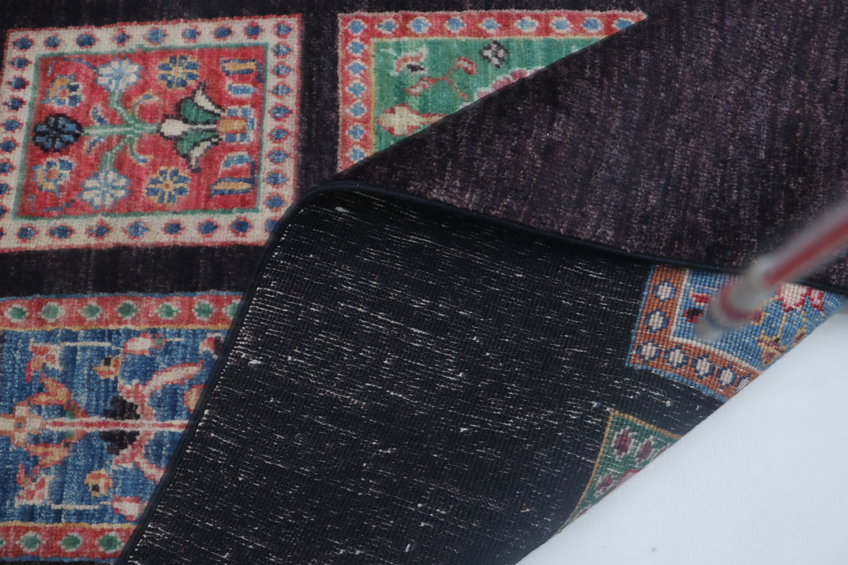 Detail view 9 of black Chobi 35/40 handwoven wool rug, 5.5 x 8 ft