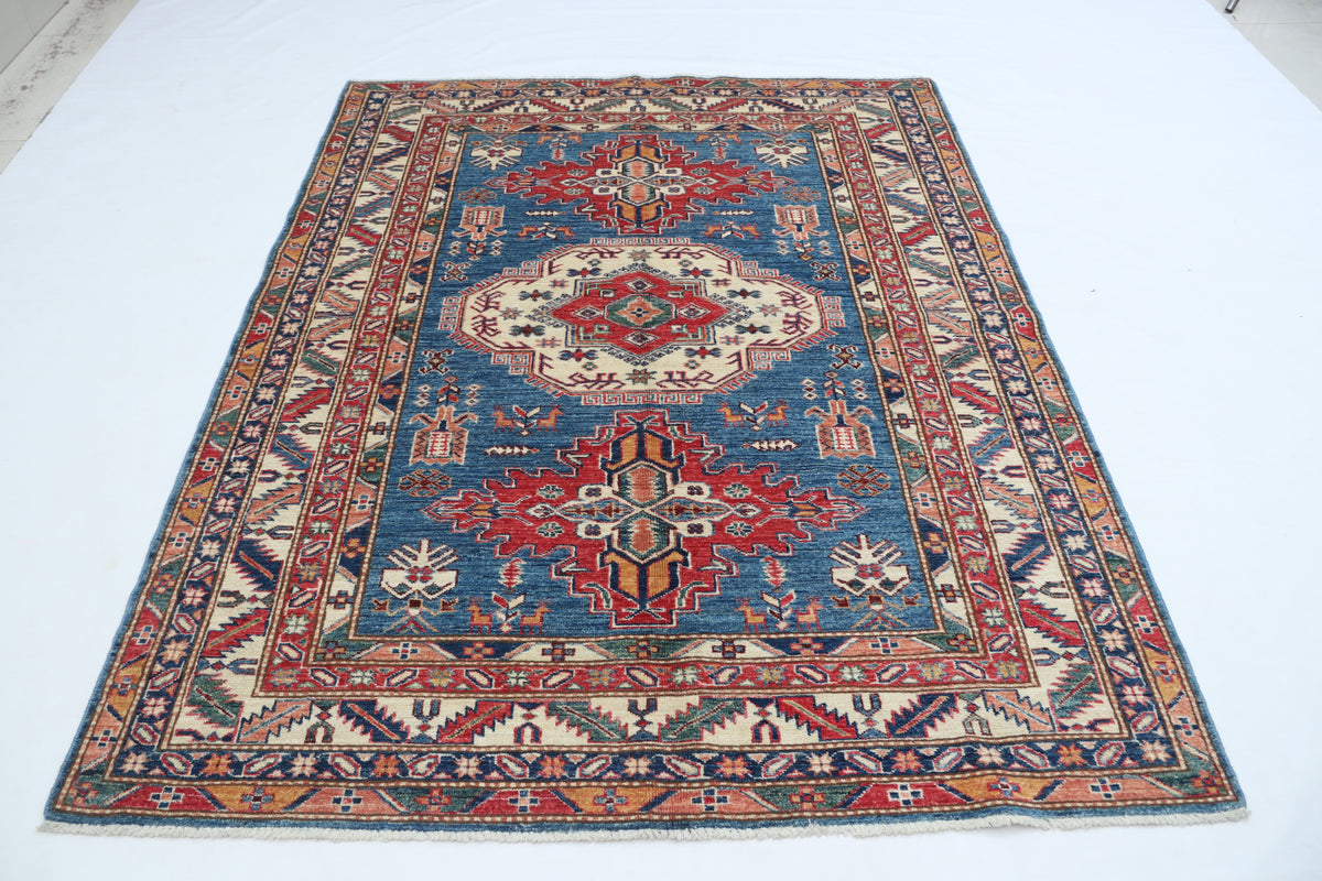 Detail 2 of blue floral Super Kazak cotton-and-wool rug, 5 x 6.5 ft