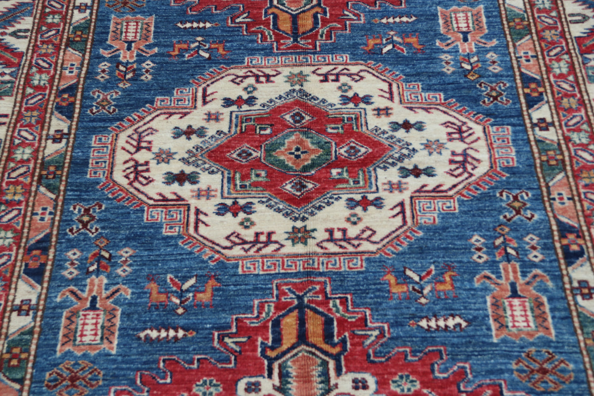 Detail 3 of blue floral Super Kazak cotton-and-wool rug, 5 x 6.5 ft