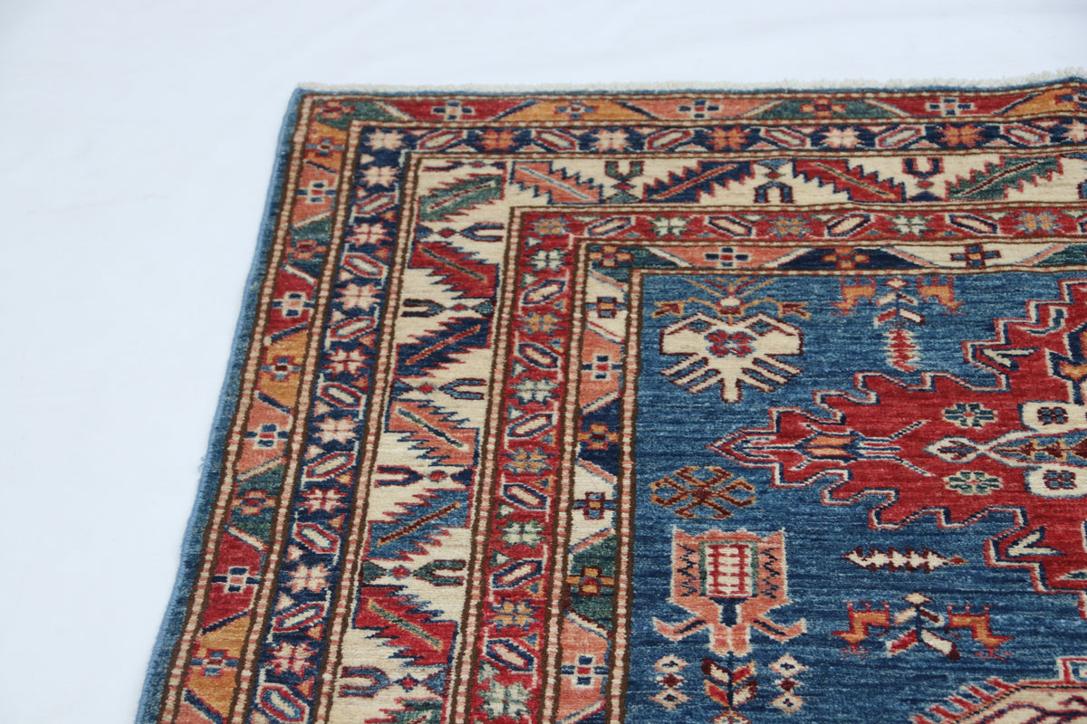 Detail 4 of blue floral Super Kazak cotton-and-wool rug, 5 x 6.5 ft