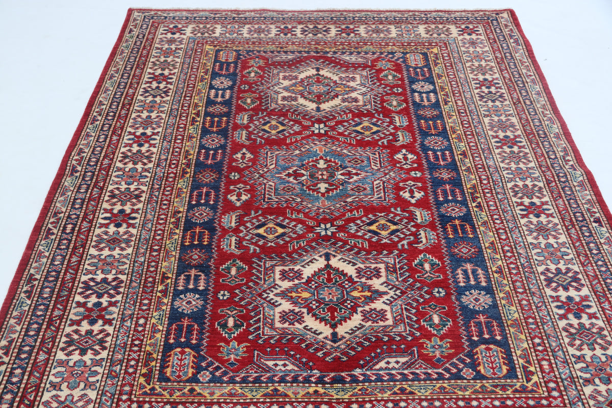 Detail view 2 of red Super Kazak handwoven wool rug, 5 x 6.5 ft