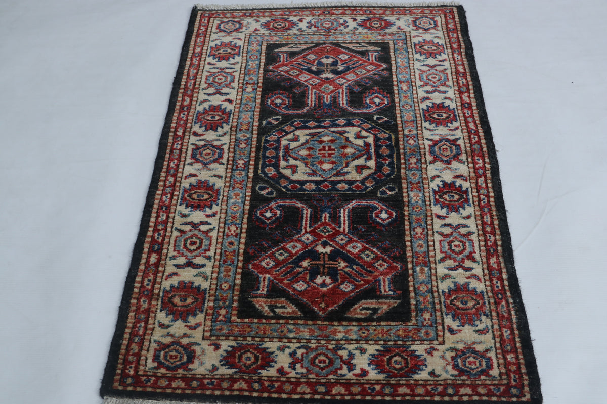 Detail 2 of black floral Super Kazak cotton-and-wool rug, 2 x 3 ft