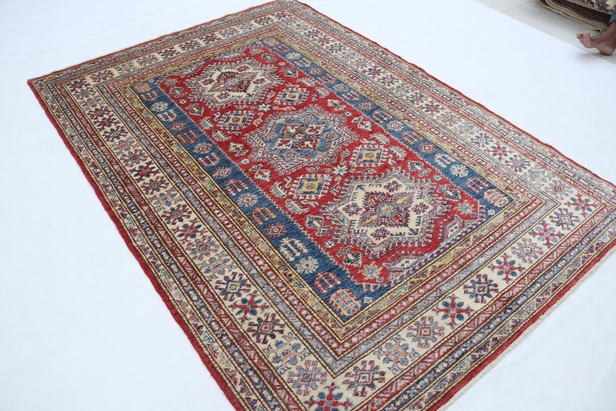 Detail 3 of red floral Super Kazak cotton-and-wool rug, 5 x 7 ft