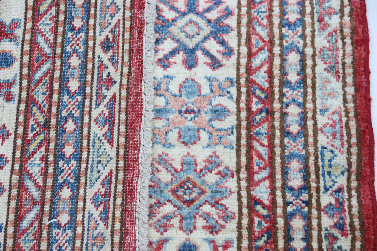 Detail 7 of red floral Super Kazak cotton-and-wool rug, 5 x 7 ft