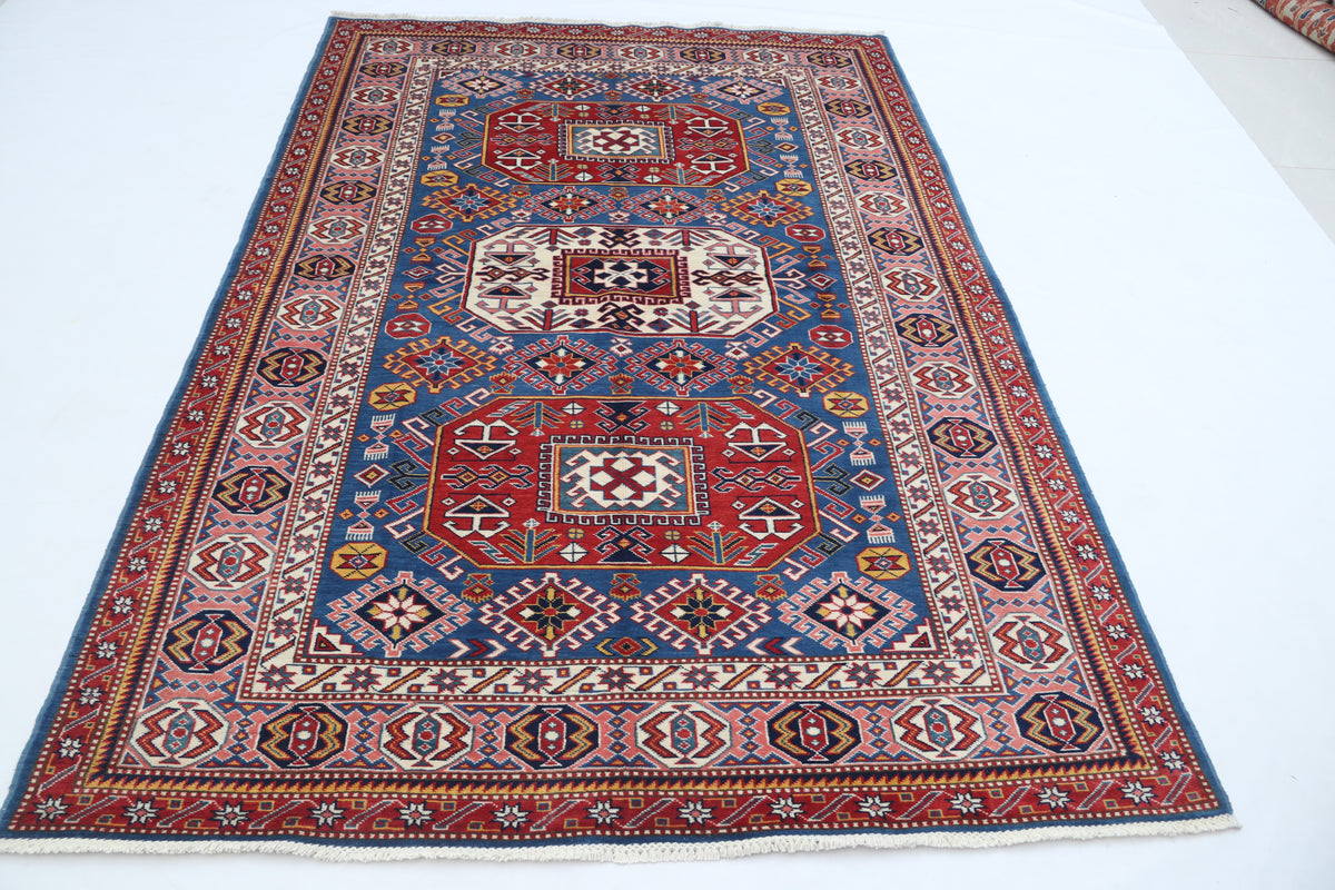 Detail 2 of blue floral Super Kazak cotton-and-wool rug, 5 x 7 ft