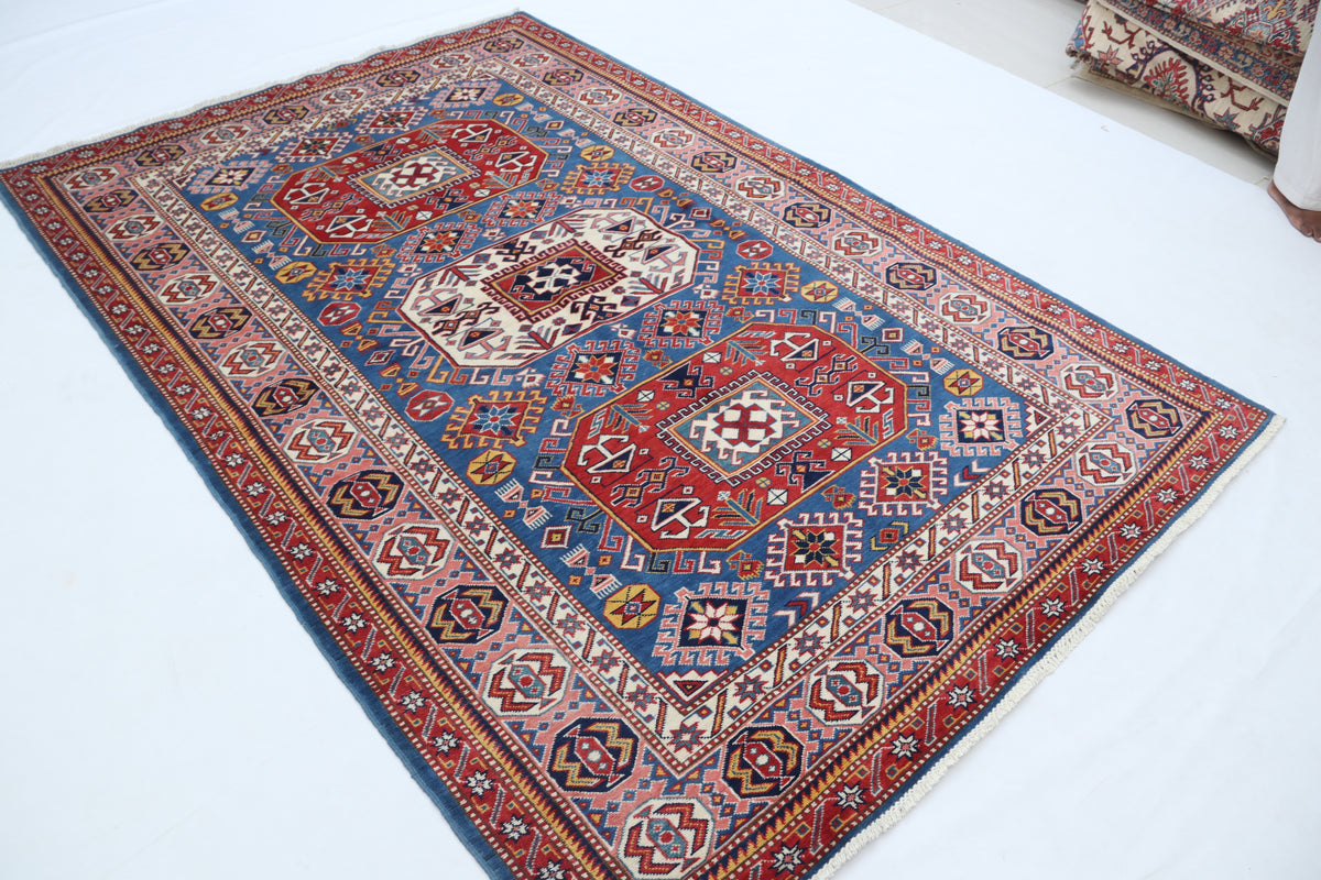 Detail 3 of blue floral Super Kazak cotton-and-wool rug, 5 x 7 ft