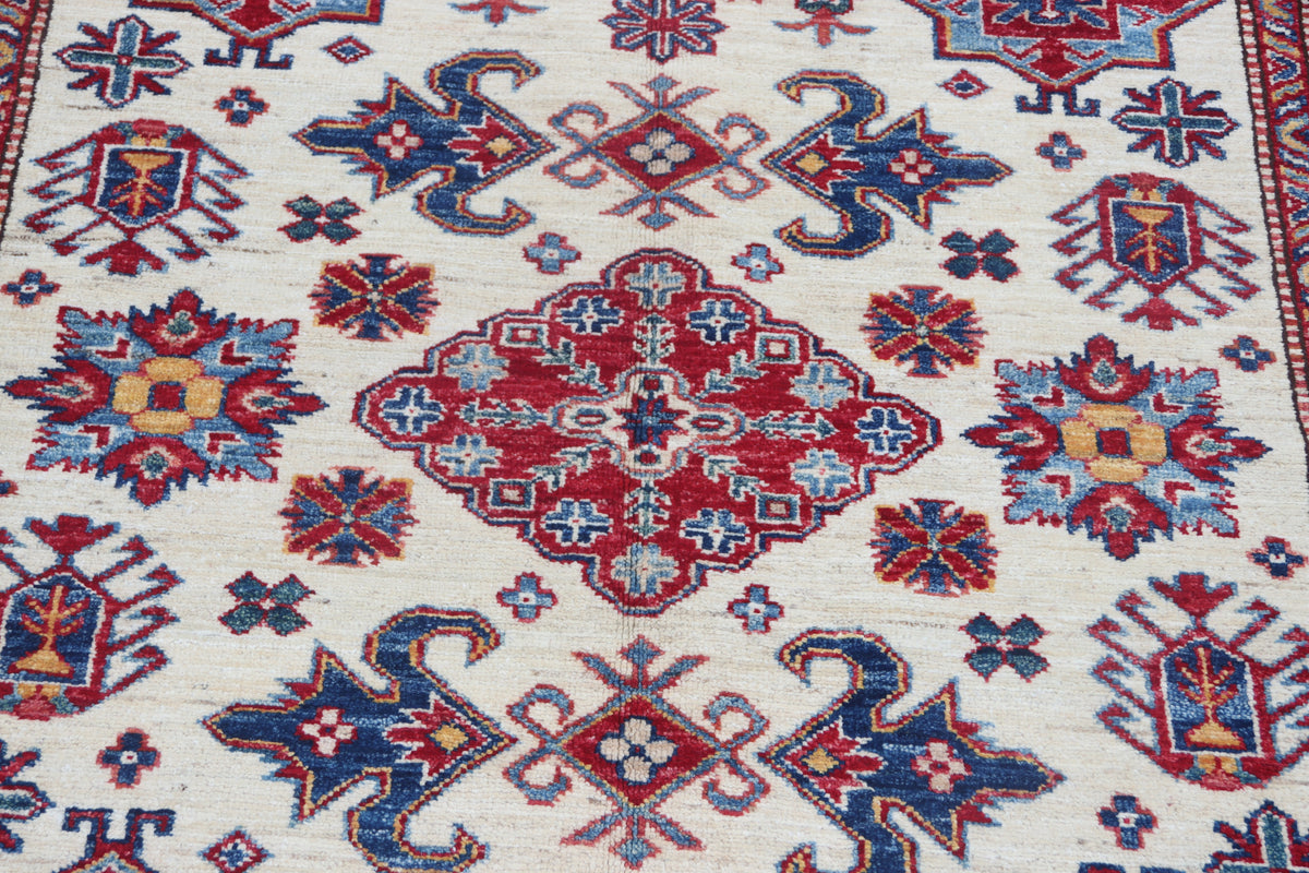 Detail 3 of beige floral Super Kazak cotton-and-wool rug, 5.5 x 8 ft