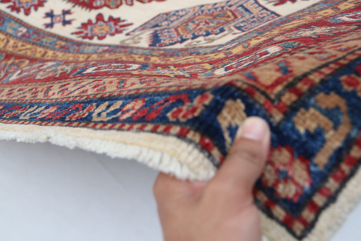 Detail 7 of beige floral Super Kazak cotton-and-wool rug, 5.5 x 8 ft