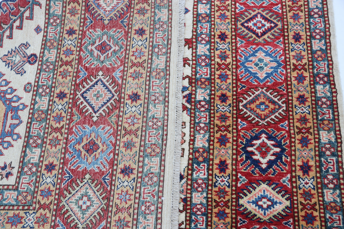 Detail 7 of beige floral Super Kazak cotton-and-wool rug, 5.5 x 8 ft