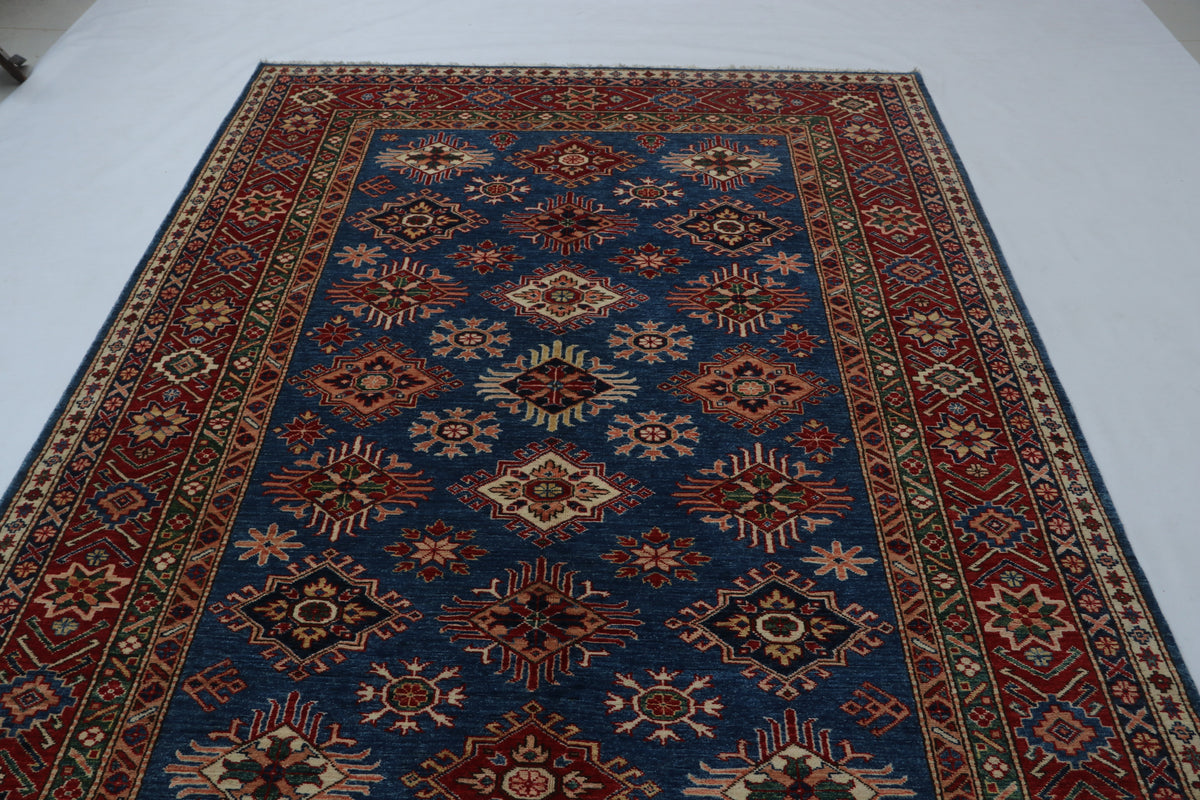 Detail 5 of blue floral Super Kazak cotton-and-wool rug, 6 x 9 ft