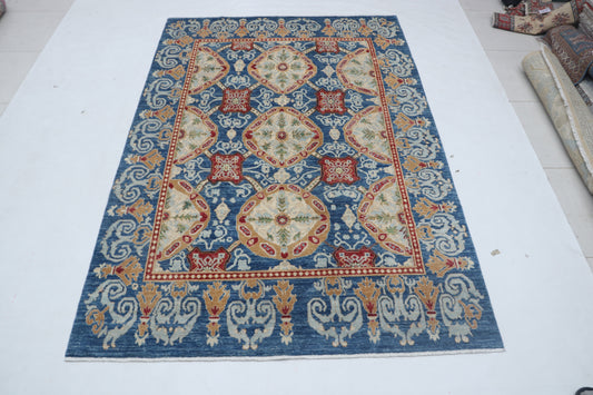 Full view of blue Chobi 35/40 handwoven wool rug, 6 x 9 ft