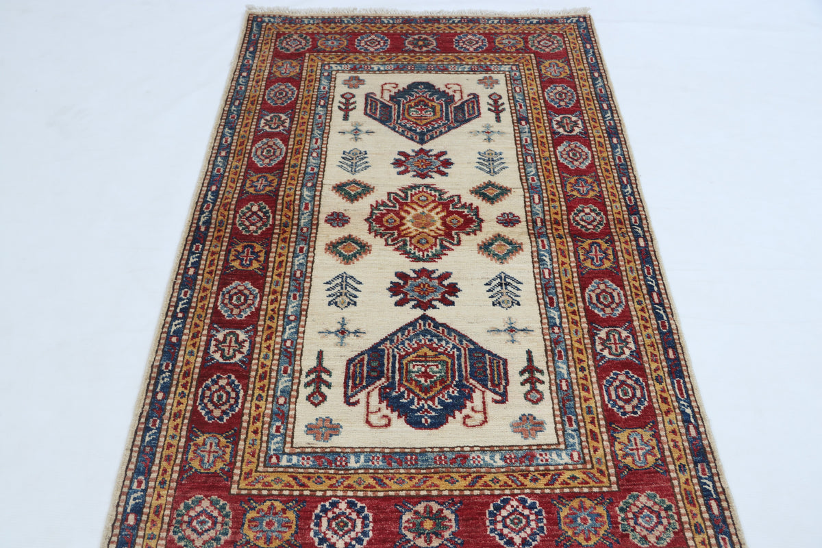 Detail view 2 of beige Super Kazak handwoven wool rug, 2.5 x 4 ft
