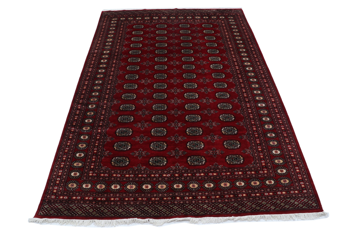 Detail view 2 of red Mori Bokhara handwoven wool rug, 7 x 10 ft