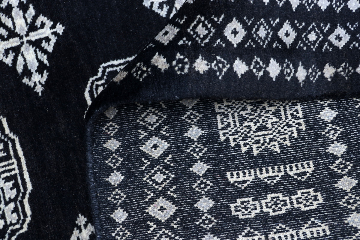 Detail view 9 of black Mori Bokhara handwoven wool rug, 7 x 10 ft