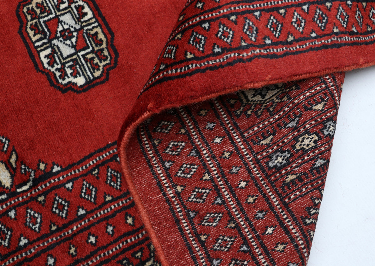 Detail view 9 of red Mori Bokhara handwoven wool rug, 7 x 10 ft
